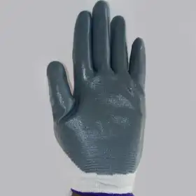 Durable white and gray coated gloves for industrial safety and worker protection, offered by Vedhika Enterprise in Coimbatore, Tamil Nadu